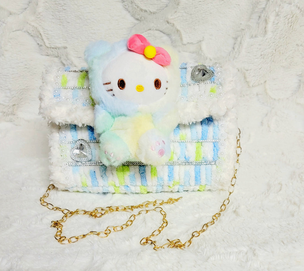 Handmade plastic canvest purse with a Hello Kitty plushy.