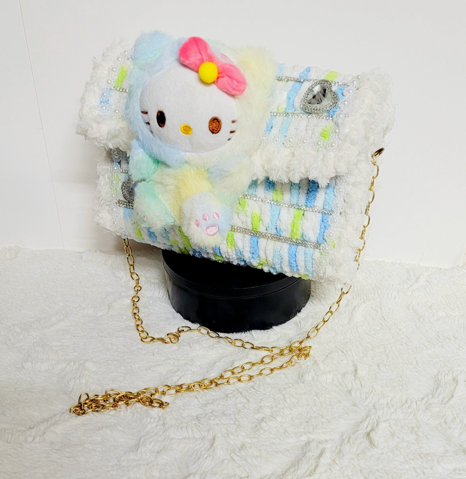 Handmade plastic canvest purse with a Hello Kitty plushy.